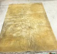 A Chinese superwash rug of plain yellow ground approx.