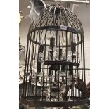 A modern wrought iron "bird cage" eight light electrolier