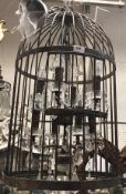 A modern wrought iron "bird cage" eight light electrolier