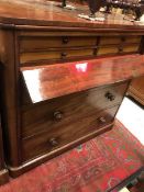 A Victorian mahogany chest with fall front compartment enclosing four drawers over three long