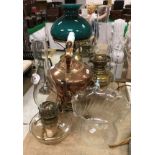 A Victorian copper samovar with milk glass handles together with three various Victorian oil lamps