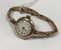 A circa 1900 9 carat gold cased ladies Rolex wristwatch with expanding bracelet,