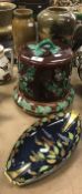 A Majolica holly decorated cheese dome and cover, a Carltonware boat shaped dish,