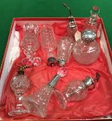 A collection of nine various cut glass dressing table scent bottles including one grenade form