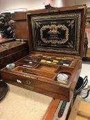 A late Victorian mahogany artist's box the figured top with brass inlaid medallion opening to