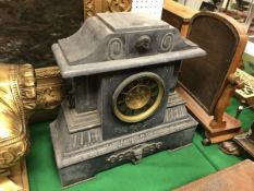 A Victorian black marble cased mantle clock of architctural form,