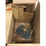A box containing various leather and/or embossed folders including a red Morocco wallet stamped "J.