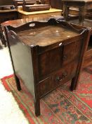 A George III mahogany night table the tray top above cupboard doors and converted drawer