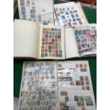 A collection of nine various stamp albums containing various mid 20th Century and later first day