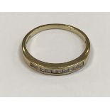 A 9 carat gold and diamond set half eternity ring,