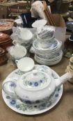 A Wedgwood "Clementine" part tea service comprising cake plate, teapot, eight cups,