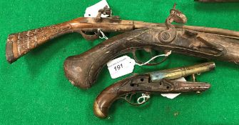 An 18th or early 19th Century flintlock pistol with walnut stock the metal work engraved "M.SE....