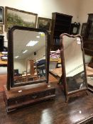 A Georgian mahogany toilet mirror with three drawers to the base,