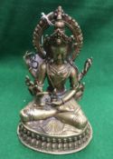 WITHDRAWN A Sino-Tibetan bronze figure seated in lotus position,