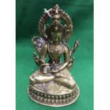 WITHDRAWN A Sino-Tibetan bronze figure seated in lotus position,