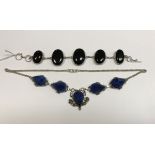 A black onyx and silver mounted bracelet and a blue stone geode style white metal mounted necklace