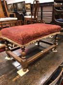 A Victorian oak stool on turned supports to block feet united by stretchers with upholstered top