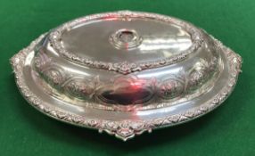 A Victorian silver vegetable tureen with embossed floral spray decoration and flower heat lattice