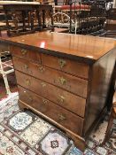 An early 18th Century walnut chest of two short and three long feather banded drawers on bracket