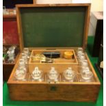 A late Victorian oak-cased apothecary's chest of rectangular form,