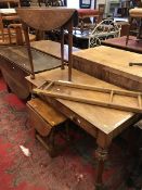 A Victorian mahogany Gothic revival two drawer side table on studded and turned tapering legs