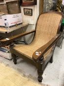 An early 20th Century cane seated plantation chair