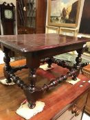 A 19th Century yew wood table the plain top on bobbin turned legs united by bobbin turned stretcher