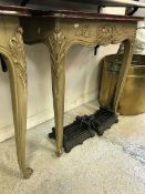 A pair of console tables the painted tops above carved scrolling shelf decoration raised on two