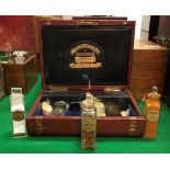 A Victorian leather-covered travelling apothecary's chest with tooled and gilded greek key banding,