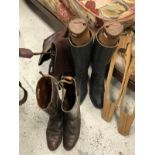 A pair of brown leather hunting boots