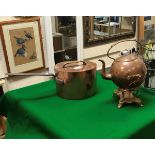 A Victorian copper saucepan with lid (possibly later) and copper and brass spirit kettle (burner