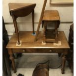 A Victorian mahogany Gothic revival two drawer side table on studded and turned tapering legs