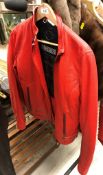A Harley Davidson ladies red leather jacket,