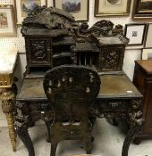 A 20th Century Chinese carved black-lacquered and painted writing table with raised superstructure