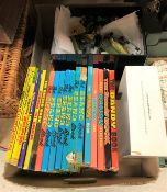 A box containing various childrens cartoon annuals including The Beano Book 1977-1983 inclusive,
