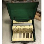 A Hohner Verdi II simulated mother of pearl veneered piano accordion with case