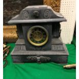 A Victorian black marble cased mantle clock of architctural form,