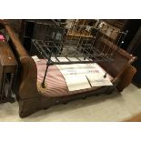 A 19th Century mahogany sleigh bed frame with mattress
