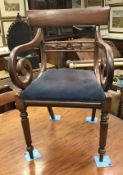 A set of five Regency mahogany bar back dining chairs with drop in seats on turned and octagonal