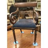 A set of five Regency mahogany bar back dining chairs with drop in seats on turned and octagonal