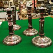 A set of four George III Sheffield plated telescopic candlesticks with beaded decoration by Matthew