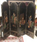 A Chinese black laquered and gilt four fold screen, decorated with figures on each panel,