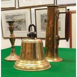 A brass bell, brass jug in the Art Nouveau style, brass candlestick,