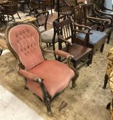A collection of chairs comprising two 19th Century panel-seated elbow chairs,