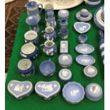 A collection of Wedgwood and other blue Jasper dip wares including cream jugs, trinket dishes,
