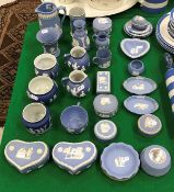 A collection of Wedgwood and other blue Jasper dip wares including cream jugs, trinket dishes,