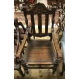 A Victorian carved oak framed open arm hall chair with panelled seat and a 19th Century oak drop