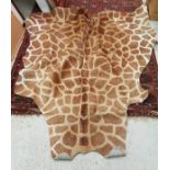 A "Giraffe" print cowhide rug