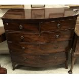 A Victorian mahogany bow-fronted chest of two short over three long drawers to bracket feet