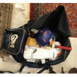 A Gunn & Moore cricket bag and contents of Purist II 505 cricket bat, cricket helmet,